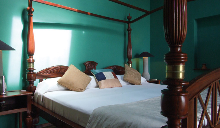 The Elephant Corridor Sri Lanka green bedroom four poster bed 