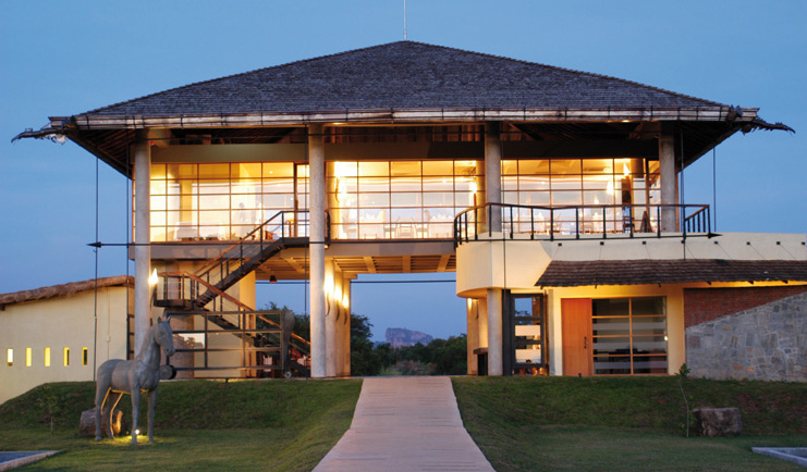 The Elephant Corridor Sri Lanka hotel exterior building with large glass windows and horse statue