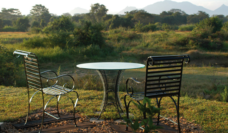 The Elephant Corridor Sri Lanka outdoor seating with garden and mountain view