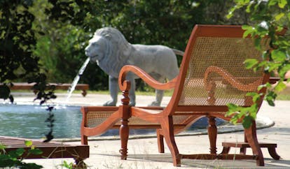 The Elephant Corridor Sri Lanka pool lounger outdoor pool lion fountain statue