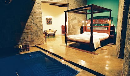 The Elephant Corridor Sri Lanka romantic suite green walls four poster bed plunge pool