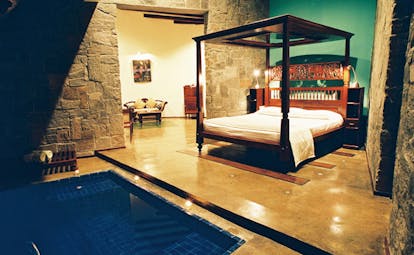 The Elephant Corridor Sri Lanka romantic suite green walls four poster bed plunge pool