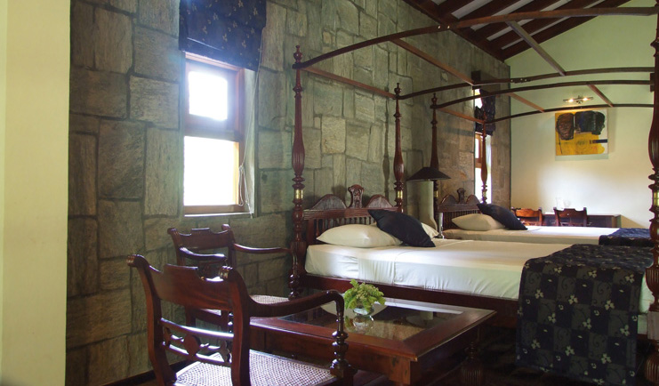 The Elephant Corridor Sri Lanka twin double bedroom four poster stone walls