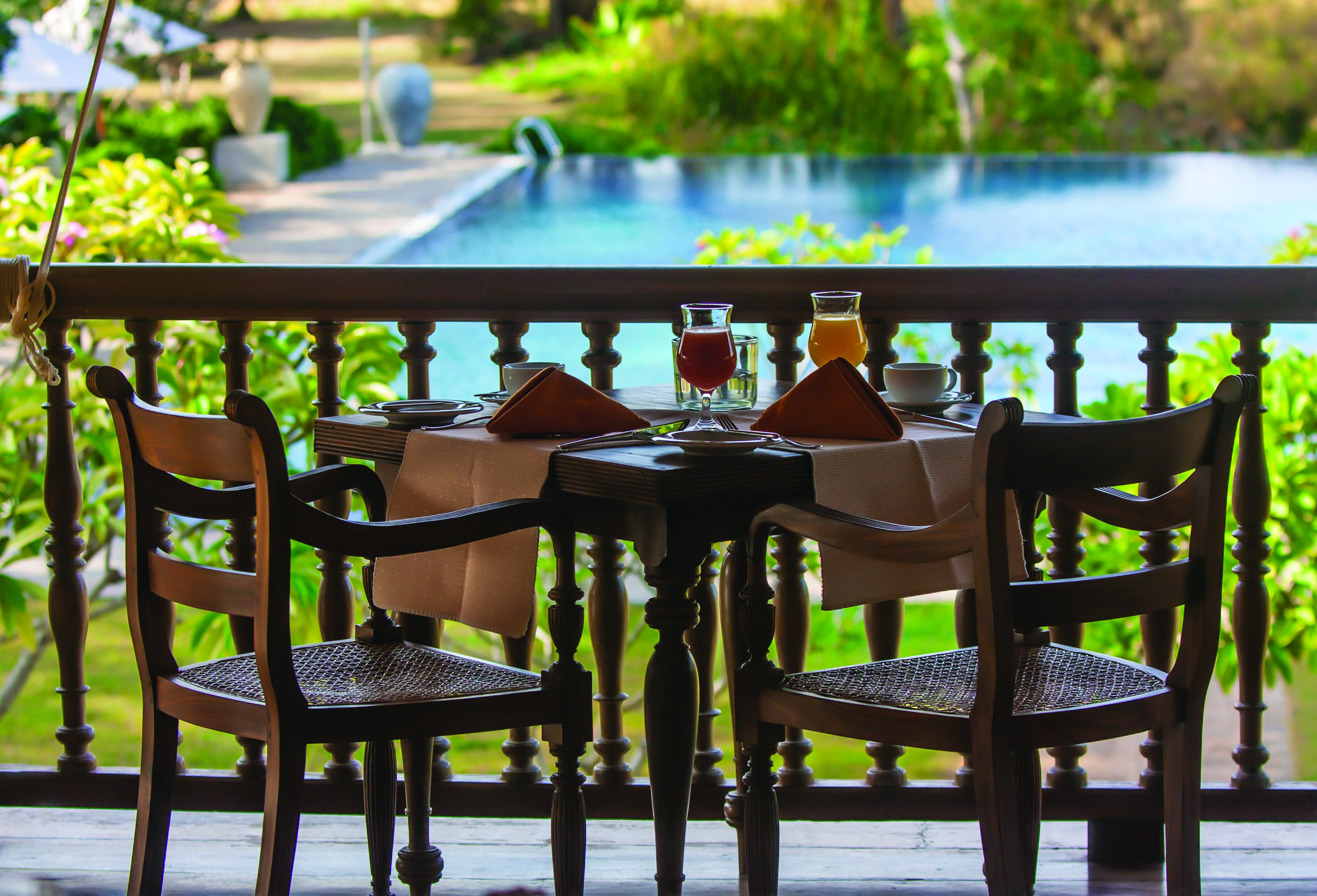 Ulagalla Resort dining terrace, outdoor dining area overlooking pool