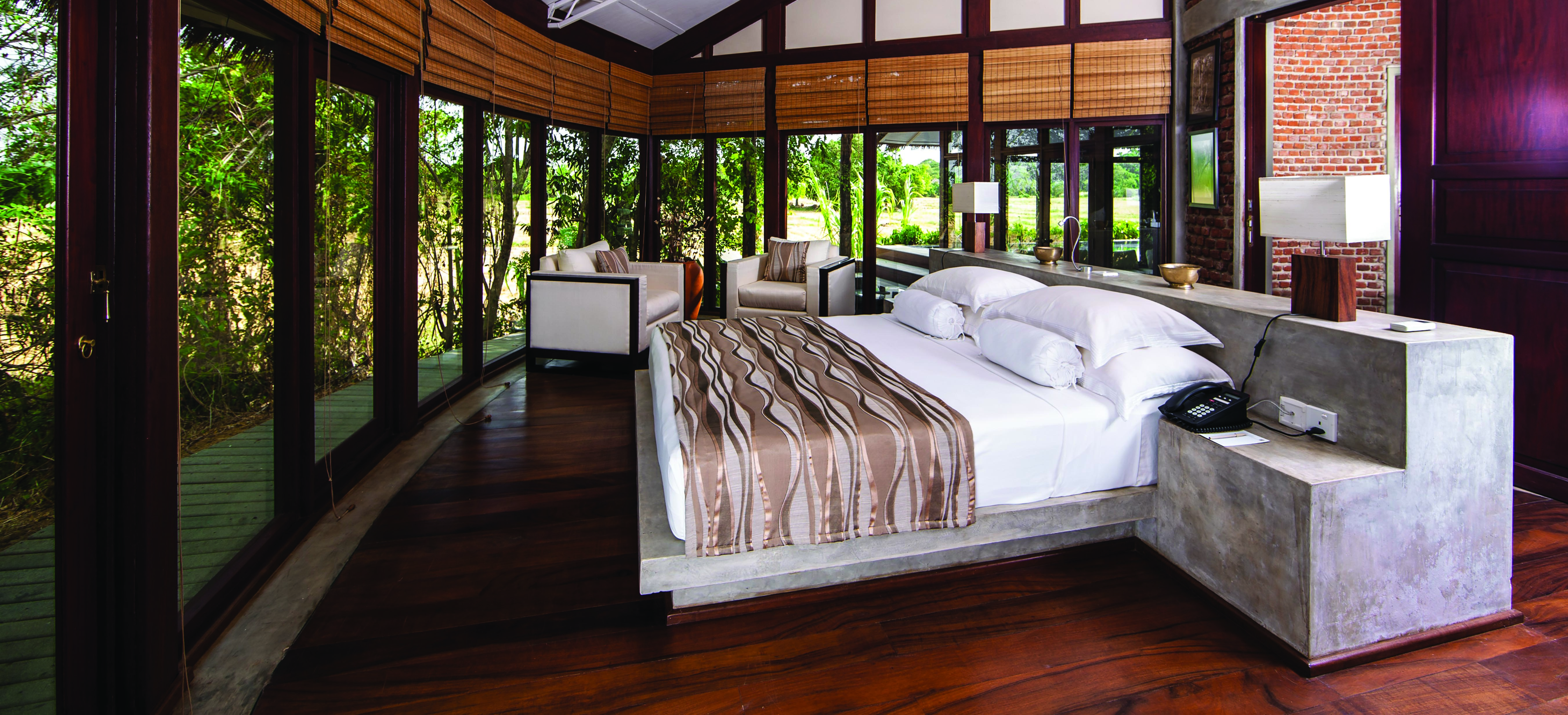 Ulagalla Resort nikaweva villa bedroom, double bed, modern decor, large floor to ceiling windows