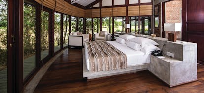 Ulagalla Resort nikaweva villa bedroom, double bed, modern decor, large floor to ceiling windows