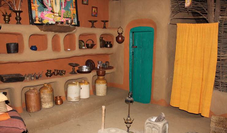 Ulpotha Sri Lanka Ayurveda treatment room with jars turquoise door and yellow curtain