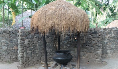 Ulpotha Sri Lanka Ayurveda water cauldron stone walls thatched cover cast iron cauldron