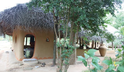 Ulpotha Sri Lanka yoga pavilion wooden hut thatched roof urn trees