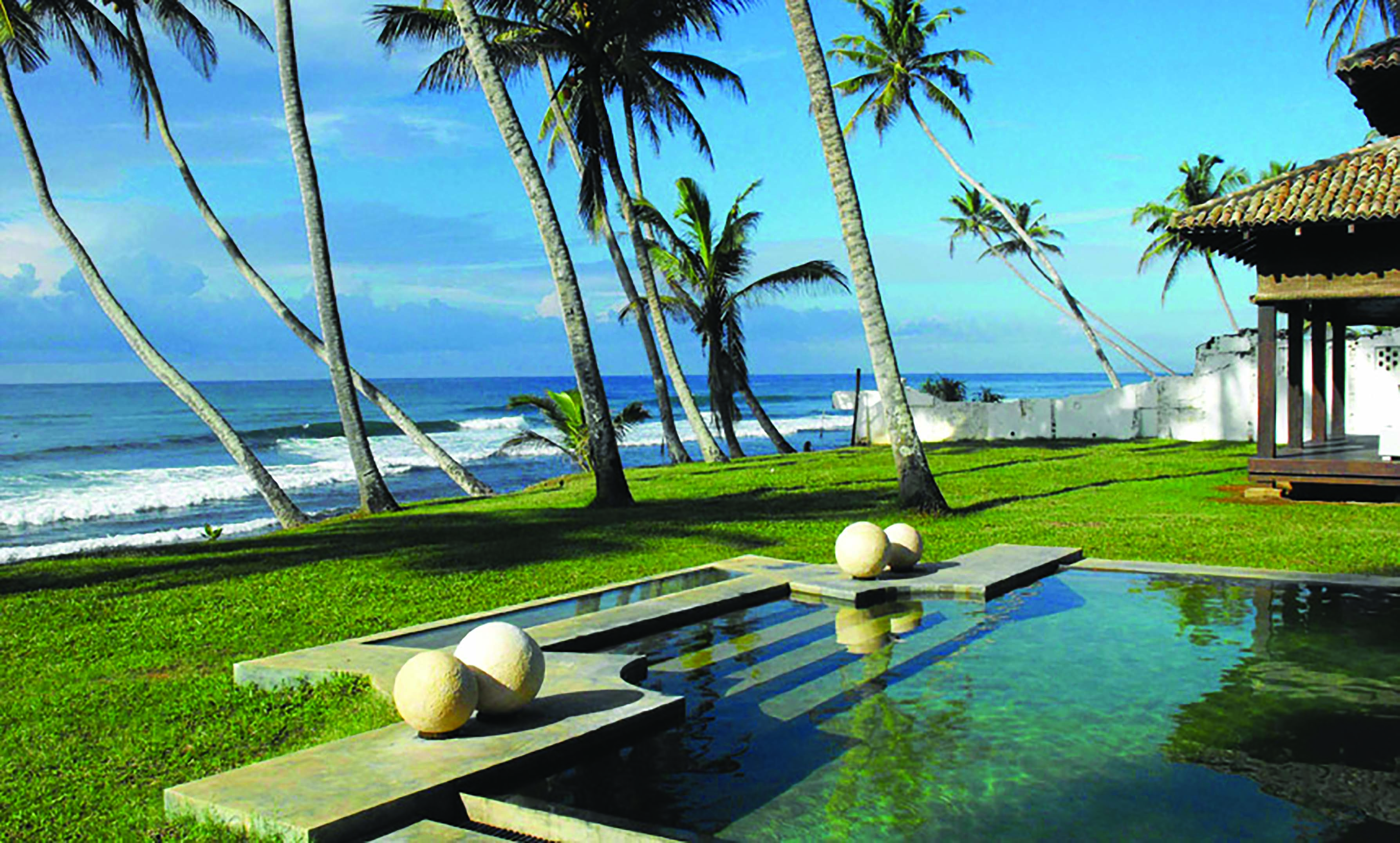 23 Palm Sri Lanka pool lawns palm trees ocean in background