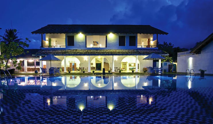 Amaloh by Jetwing Sri Lanka hotel exterior by night hotel lit up pool 