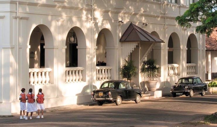Amangalla  Sri Lanka entrance white building archways classic cars