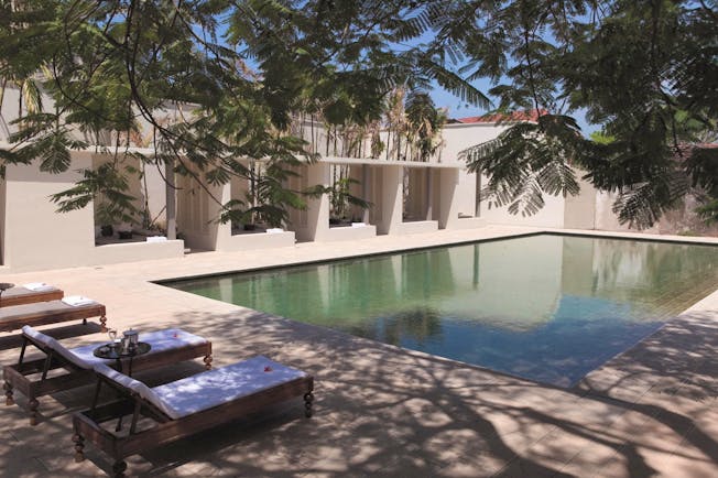 Amangalla  Sri Lanka outdoor pool sun loungers trees