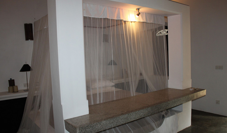 Apa Villa Thalpe Sri Lanka saffron villa bedroom four poster mosquito drapes minimalist decor
