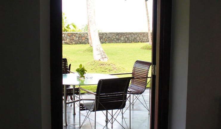 Apa Villa Thalpe Sri Lanka doorway with chairs on patio