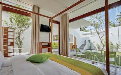 Calamansi Cove Sri Lanka bedroom bed modern décor overlooking private garden
