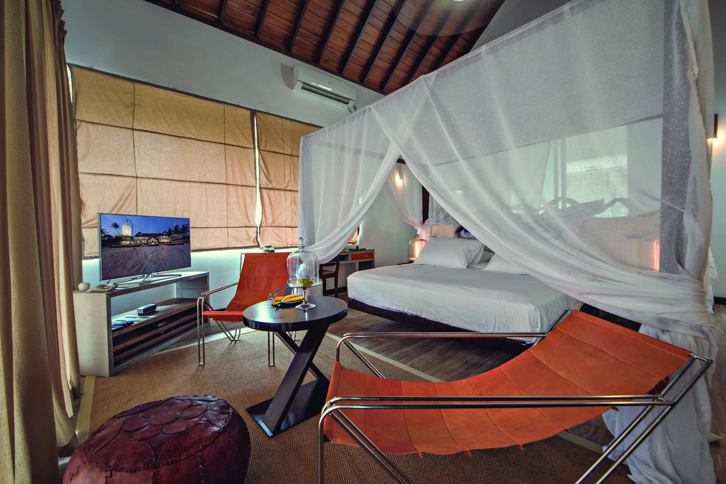 Casa Colombo Mirissa Sri Lanka beach access suite canopied bed chairs modern decor