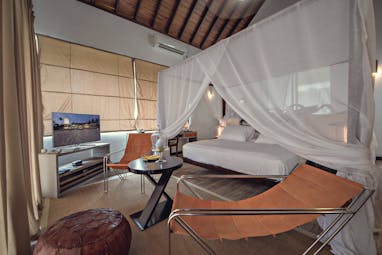 Casa Colombo Mirissa Sri Lanka beach access suite canopied bed chairs modern decor