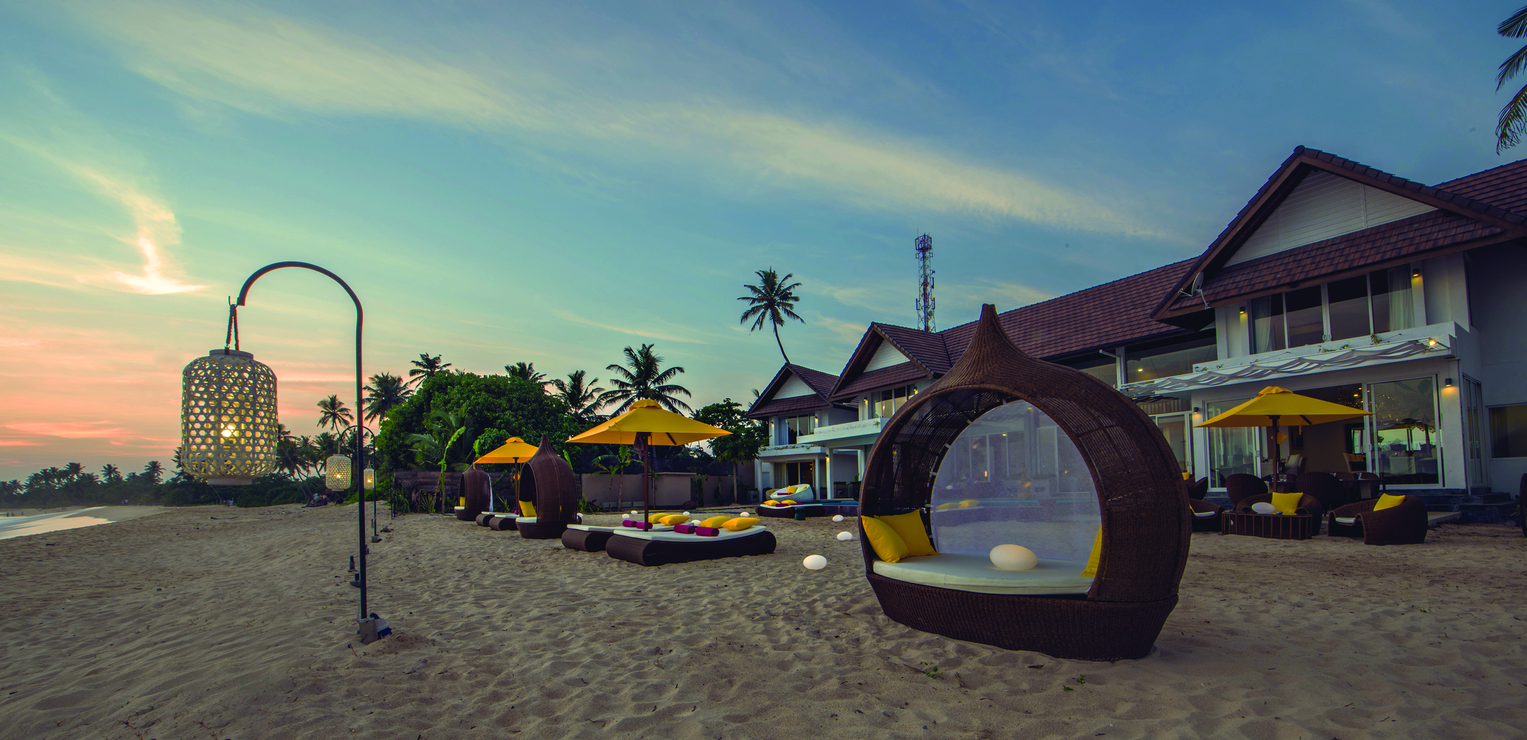 Casa Colombo Mirissa Sri Lanka beach sun beds sun loungers sand hotel in background