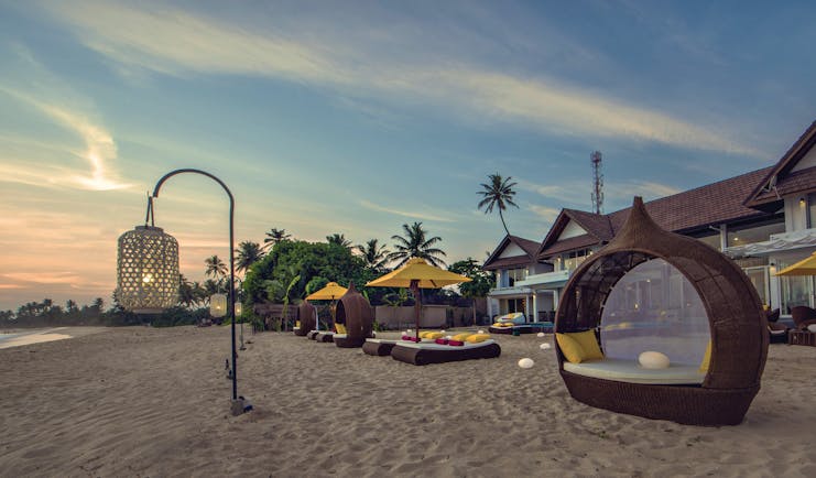 Casa Colombo Mirissa Sri Lanka beach sun beds sun loungers sand hotel in background