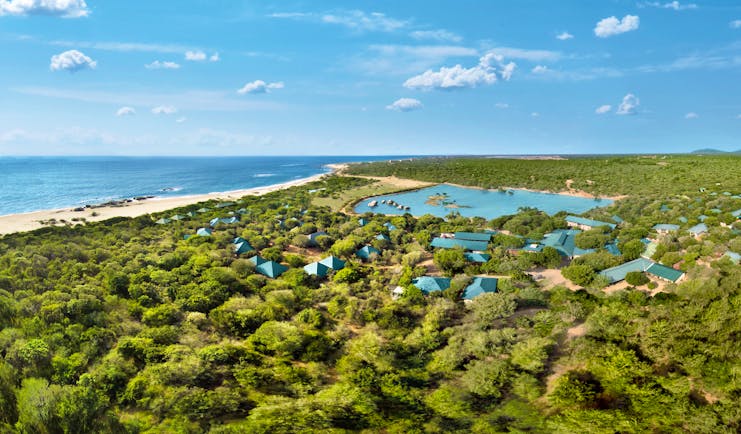 Cinnamon Wild aerial shot of resort, buildings nestled amongst tropical greenery, hotel buildings, beach and sea in background