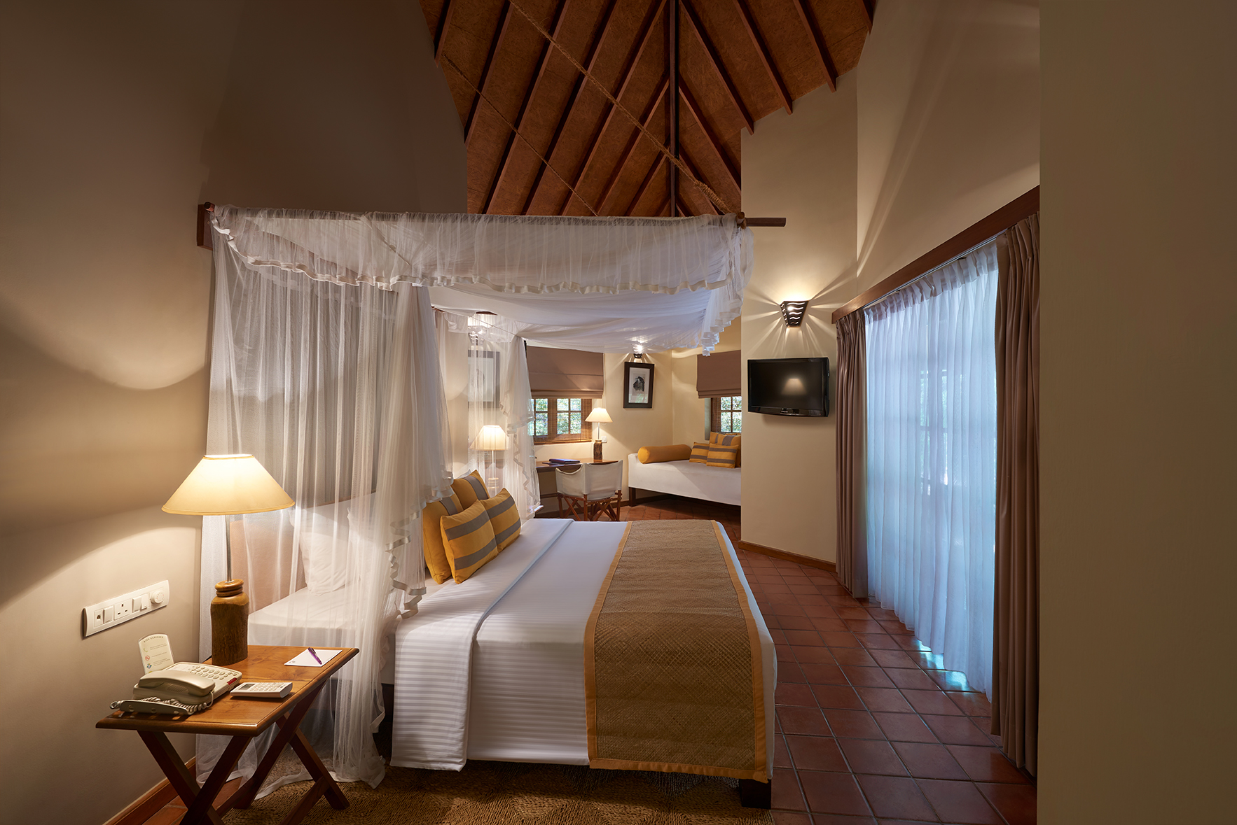 Cinnamon Wild jungle chalet, double bed with canopy, sofa, bright modern decor