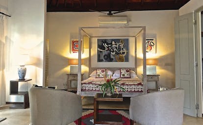 Elysium Villa Sri Lanka bedroom four poster bed armchairs elegant décor