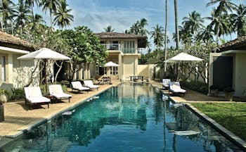 Elysium Villa Sri Lanka pool sun loungers umbrellas
