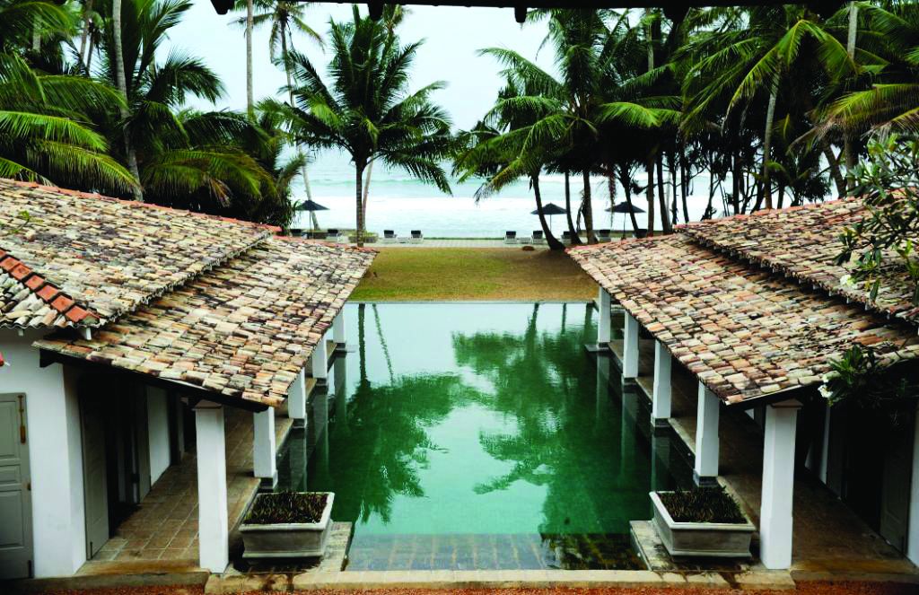 Era Beach Hotel aerial shot of pool, palm trees and beach in background
