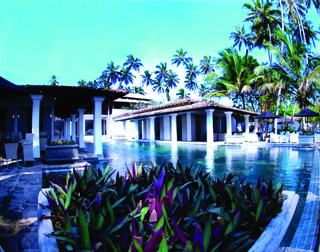 Era Beach Hotel pool and hotel grounds, flowes in pool border