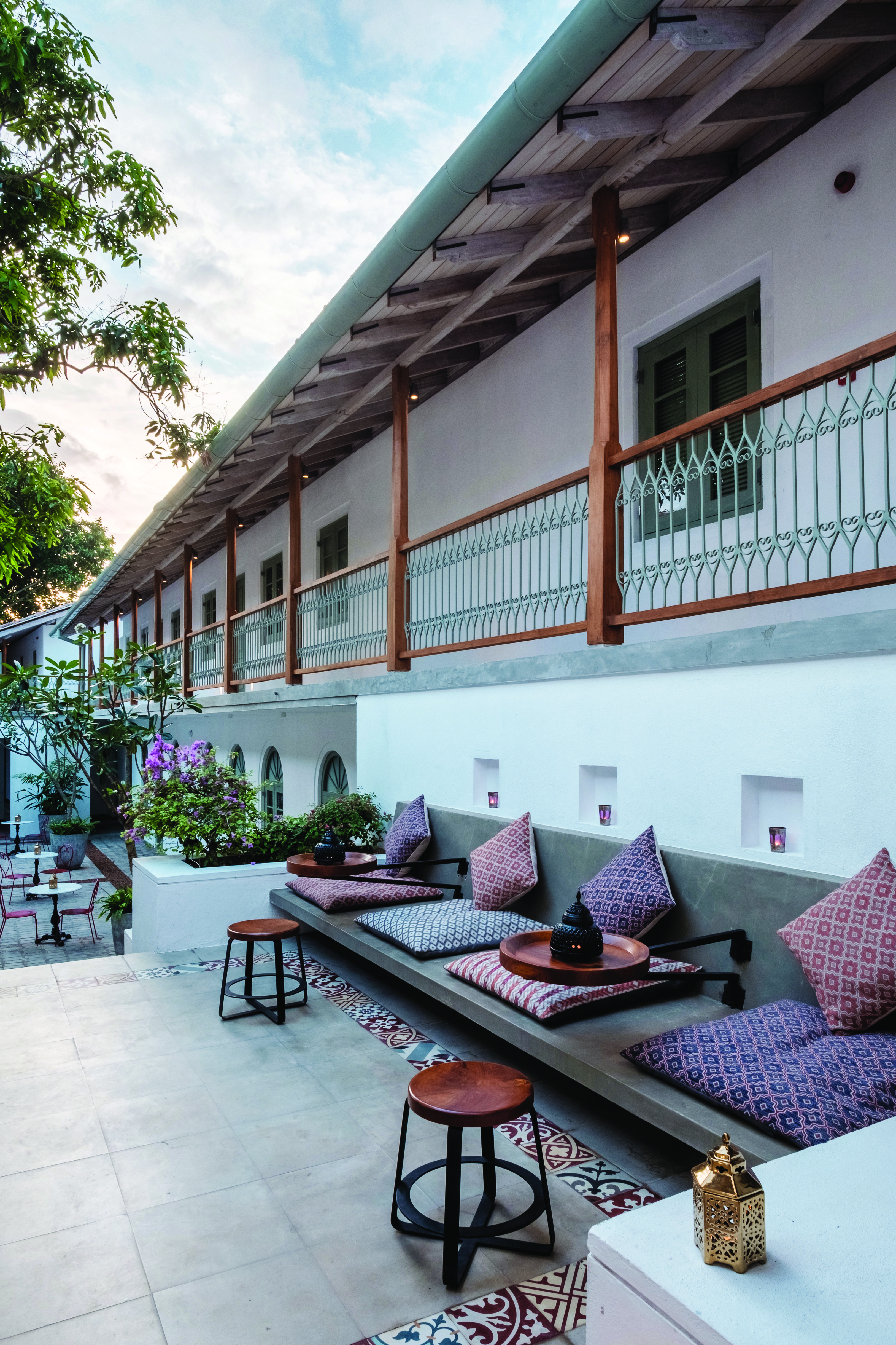 Fort Bazaar Sri Lanka courtyard communal outdoor seating area benches cushions tiles flowers