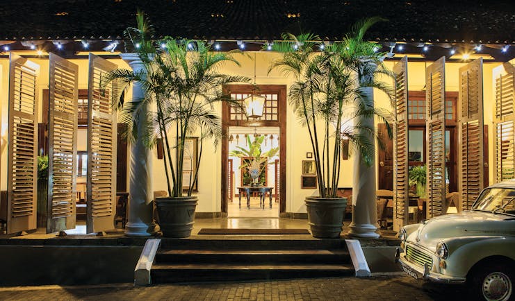 Galle Fort Hotel entrance, stairs to hotel doors, classic car, palm trees