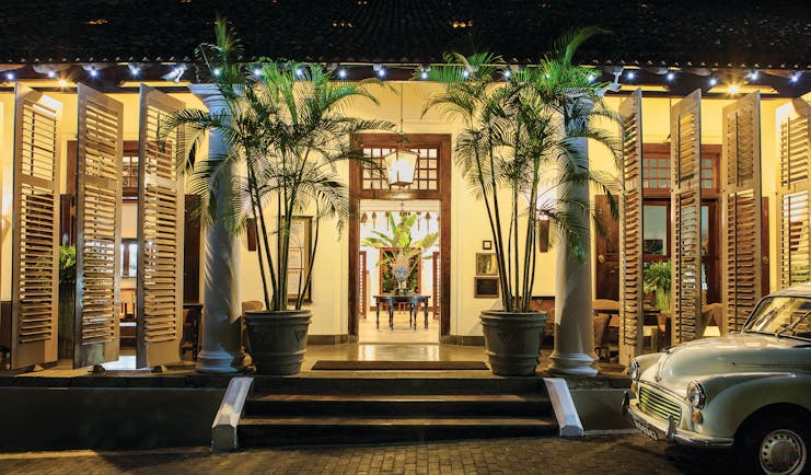 Galle Fort Hotel entrance, stairs to hotel doors, classic car, palm trees