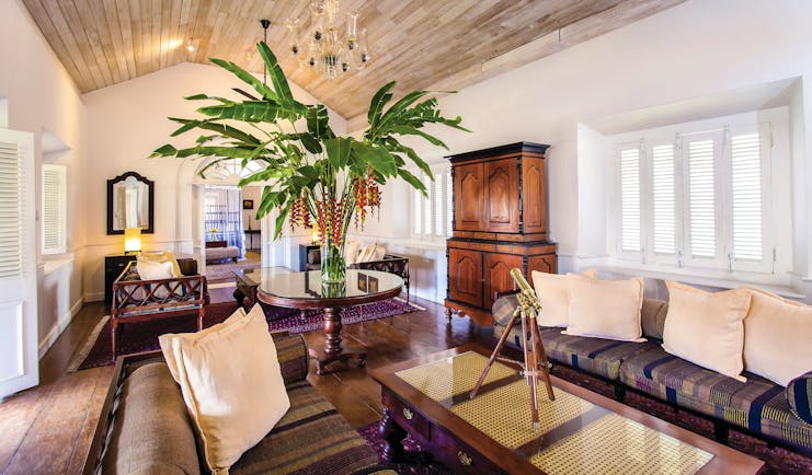 Galle Fort Hotel grand apartment lounge, sofa, glass table, elegant decor, antique furniture