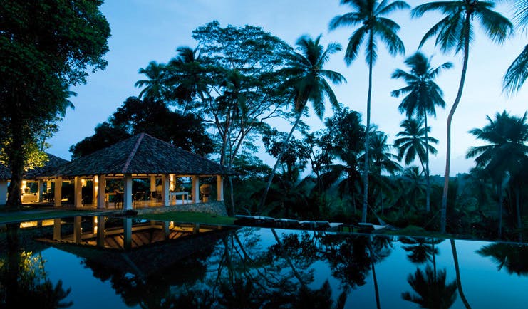 Kahanda Kanda Sri Lanka dining pavilion exterior at night time with pool view