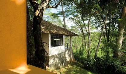 Kahanda Kanda Sri Lanka exterior bungalow yellow wall and white bungalow forest view