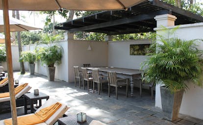 Kahanda Kanda Sri Lanka outdoor terrace sun loungers table with stools