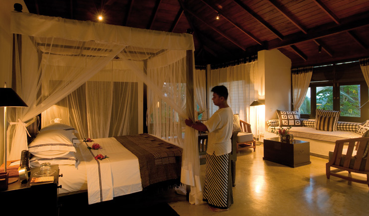 Kahanda Kanda Sri Lanka peacock suite evening man preparing room for night