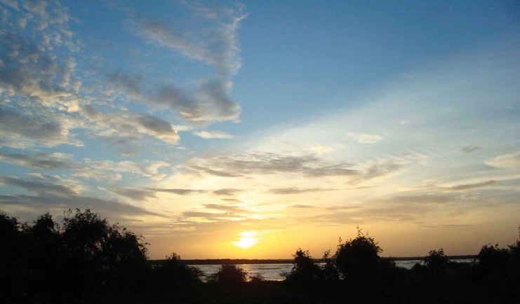 Mahoora Luxury Safari Camps Sri Lanka sunset over nature and water