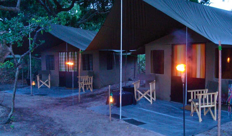 Mahoora Luxury Safari Camps Sri Lanka  tents exterior in nature deck chairs lamps