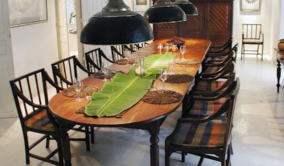The Sun House Sri Lanka dining room with long table and banana leaf runner