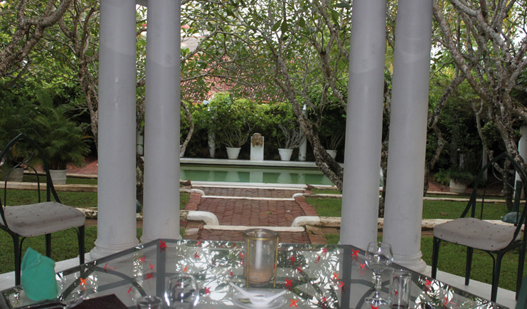 The Sun House Sri Lanka restaurant terrace with garden and pool view