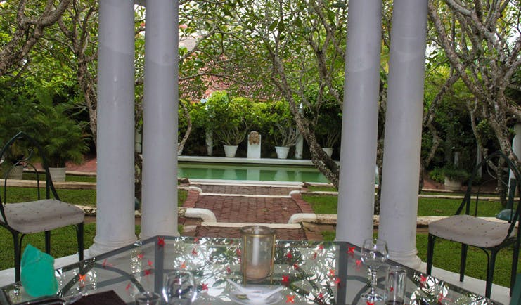 The Sun House Sri Lanka restaurant terrace with garden and pool view