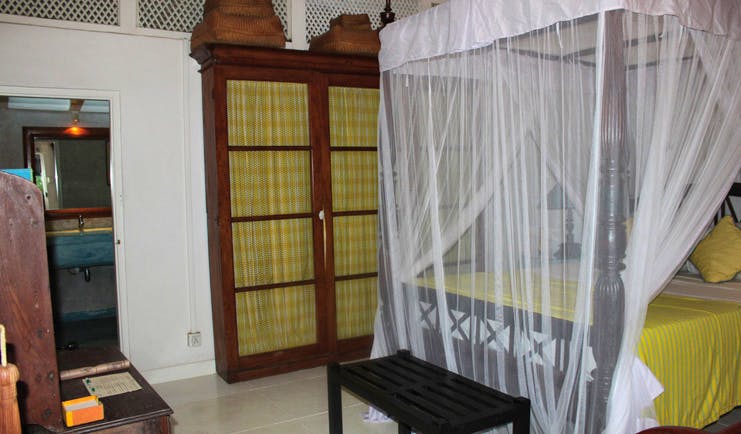 The Sun House Sri Lanka Sun and Sky suite bedroom four poster bed with white drapes