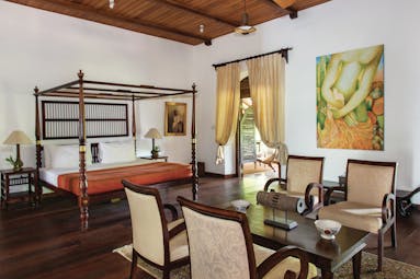 Tamarind Hill Sri Lanka admiral suite four poster bed table and chairs grand décor