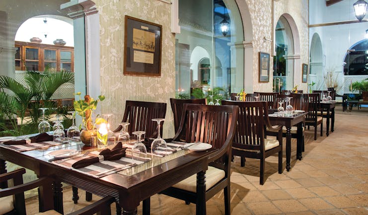 Tamarind Hill Sri Lanka indoor dining area tables chairs traditional décor