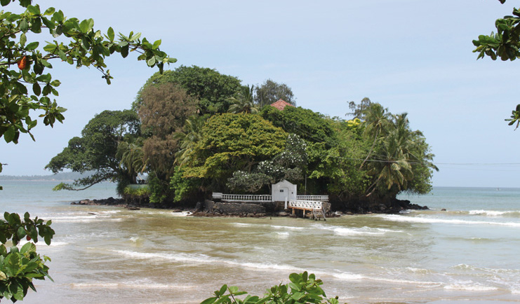 Taprobane Island Sri Lanka island trees jetty and villa rooftop