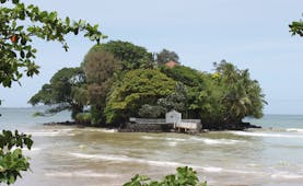 Taprobane Island Sri Lanka island trees jetty and villa rooftop