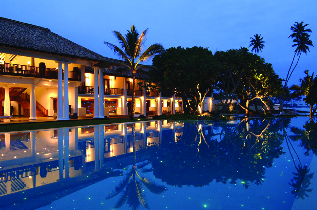 The Fortress Sri Lanka outdoor pool at night trees hotel exterior