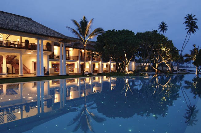 The Fortress Sri Lanka outdoor pool at night trees hotel exterior